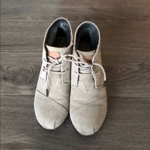 Tom’s wedge lace booties.